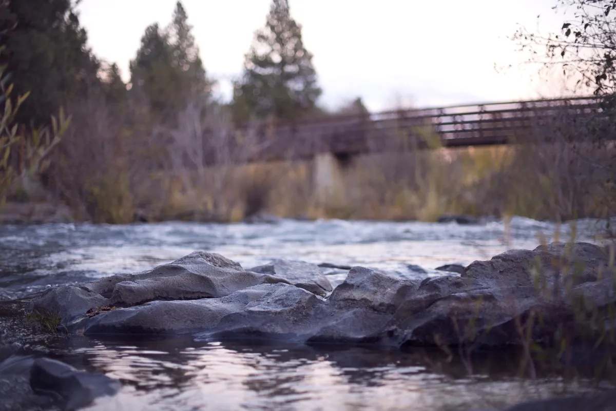 Footbridge over the rocky Deschutes River in Bend, Oregon