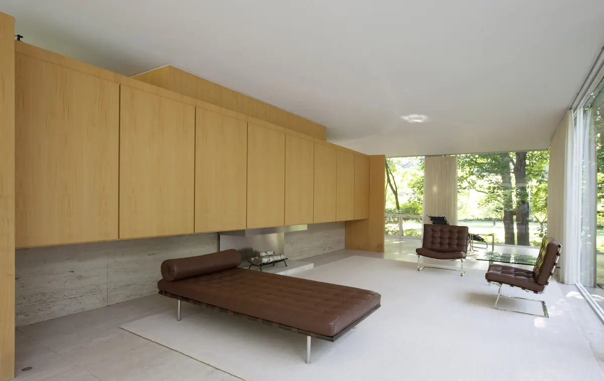 Open living room with large windows onto the trees, the kind of home found in Central Oregon associations