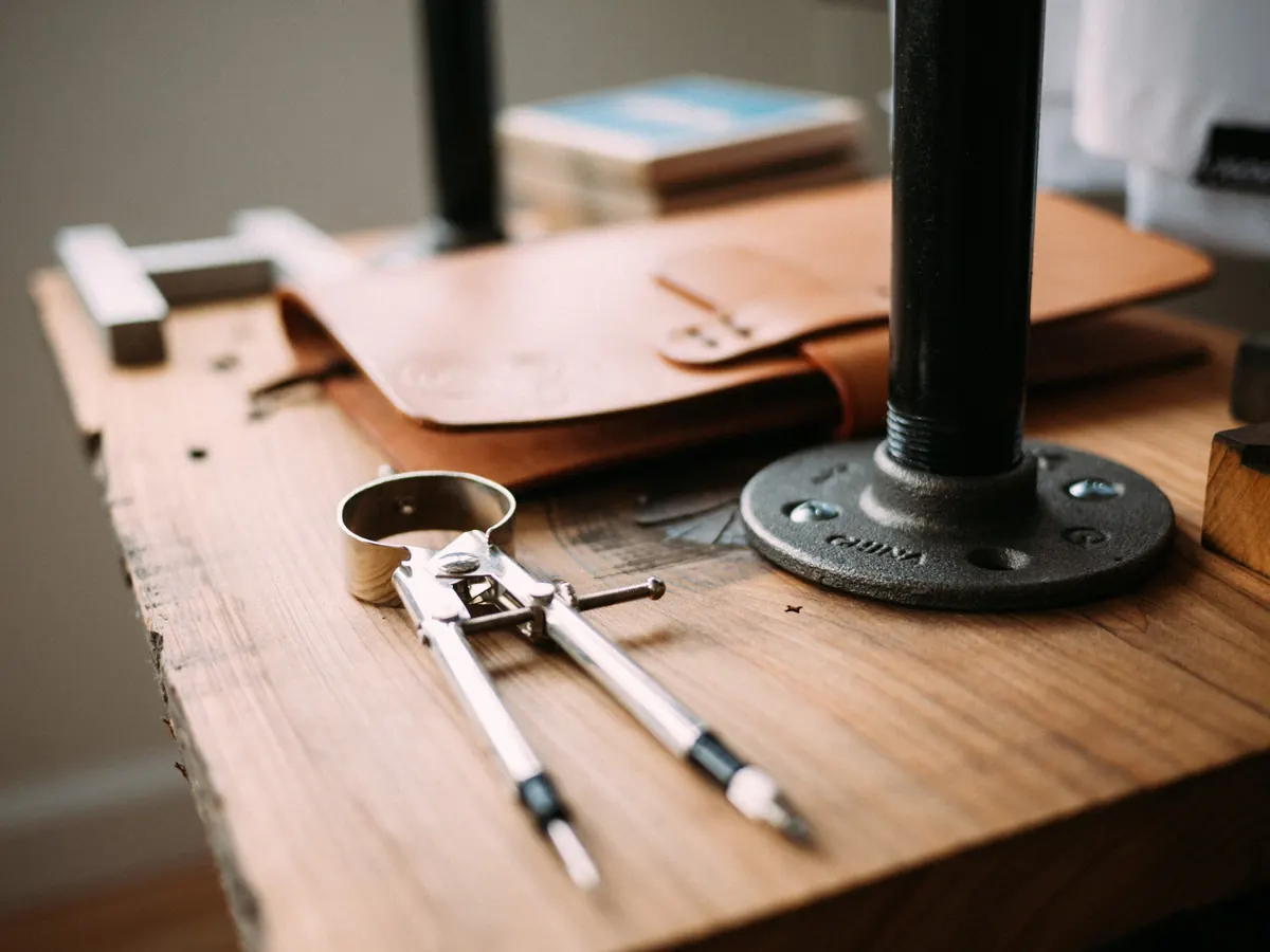 Workbench with hand tools, reflecting the construction background behind Thorn commercial property management in Bend