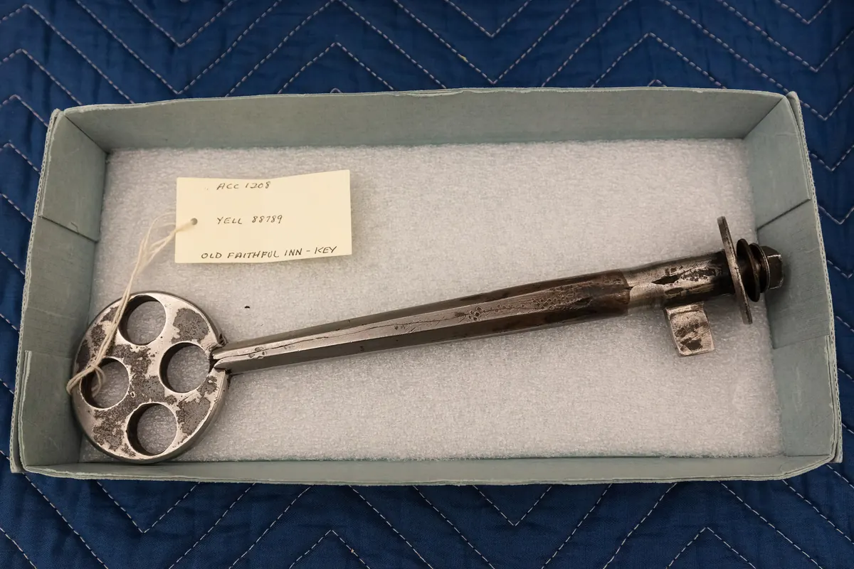 Historic metal door key resting in a box, a symbol of the property management privacy policy