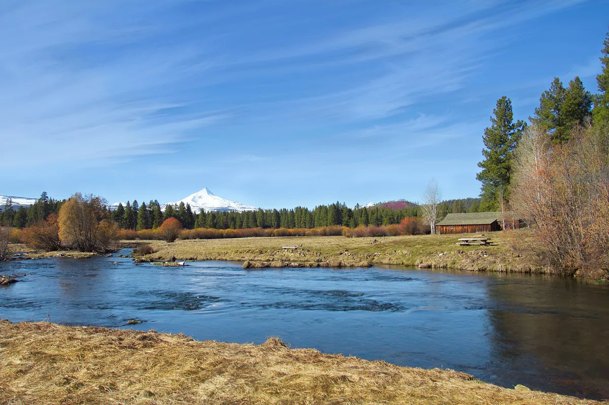 Old barn and pasture under the Cascades, the kind of rural property Tumalo property management looks after