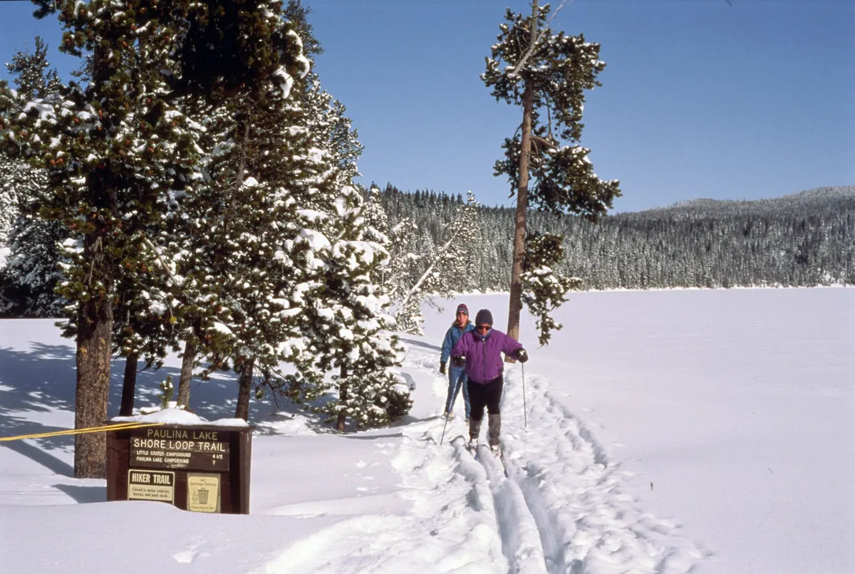 Cross-country skiers at Paulina Lake south of Bend, a winter scene near Sunriver property management